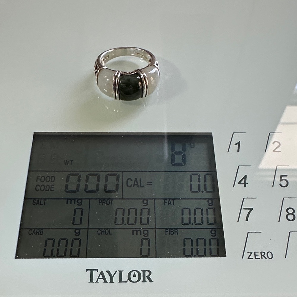 Silver sterling ring size 7 . White and green jade between silver bands.